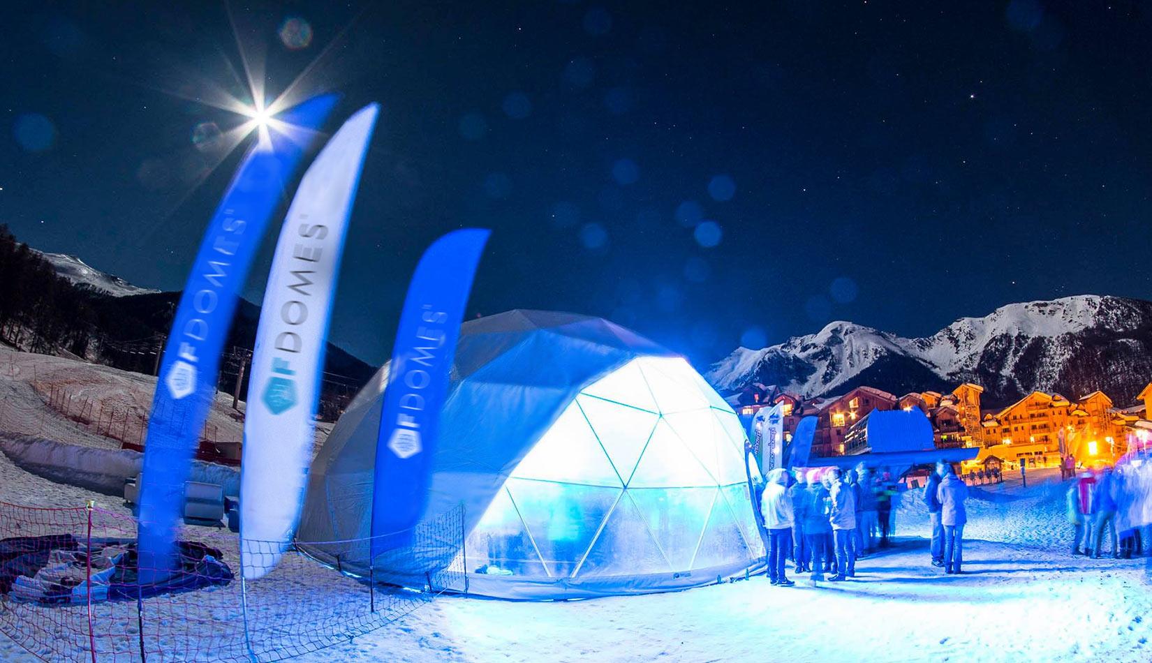 white dome tent in winter in mountain in night