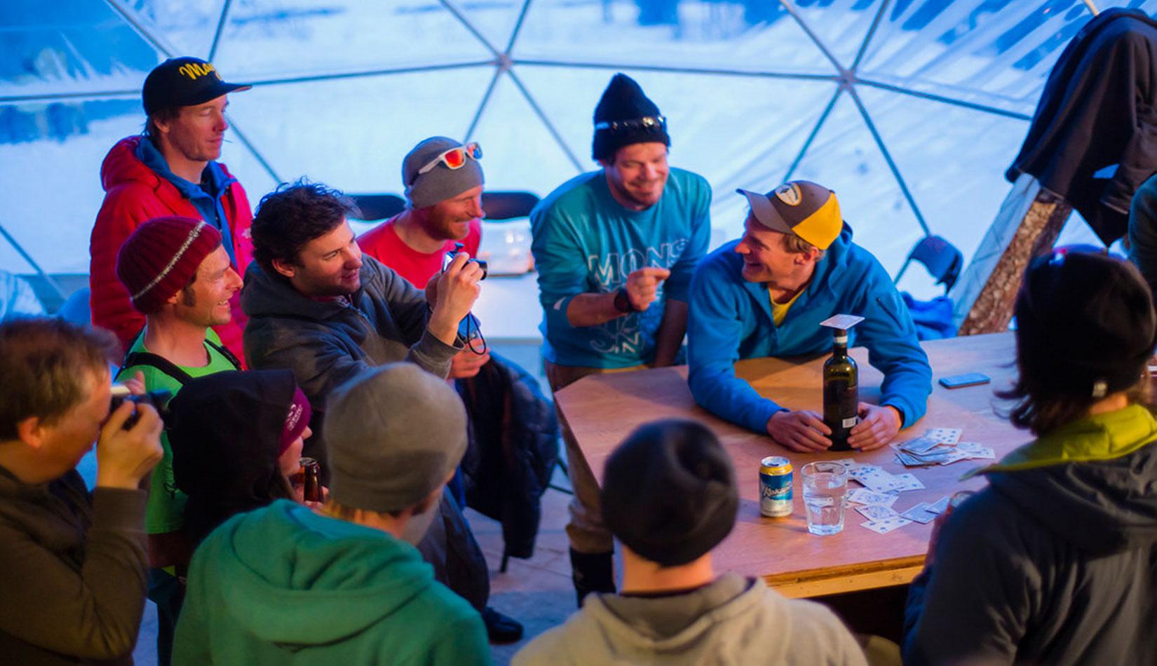 group of people in the interior of white dome tent