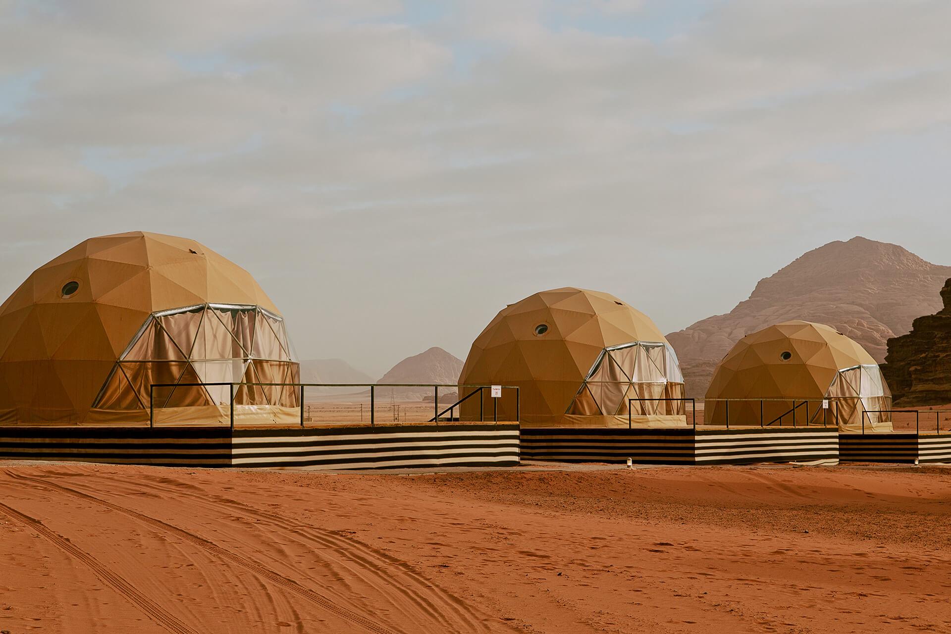 a white geodesic dome at desert