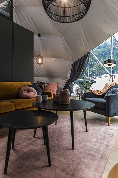 fully-equipped living room in a glamping geodesic dome