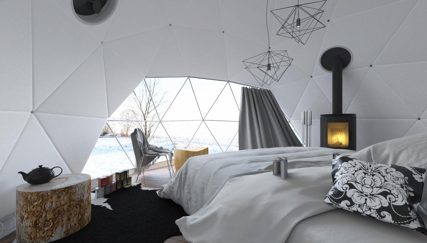 interior of geodesic dome with view at window, bed and fireplace