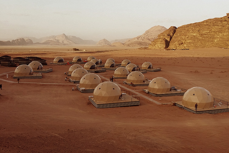 beige geodesic domes at desert
