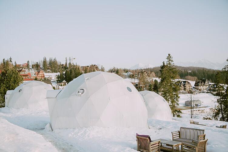 white geodesic domes in snow