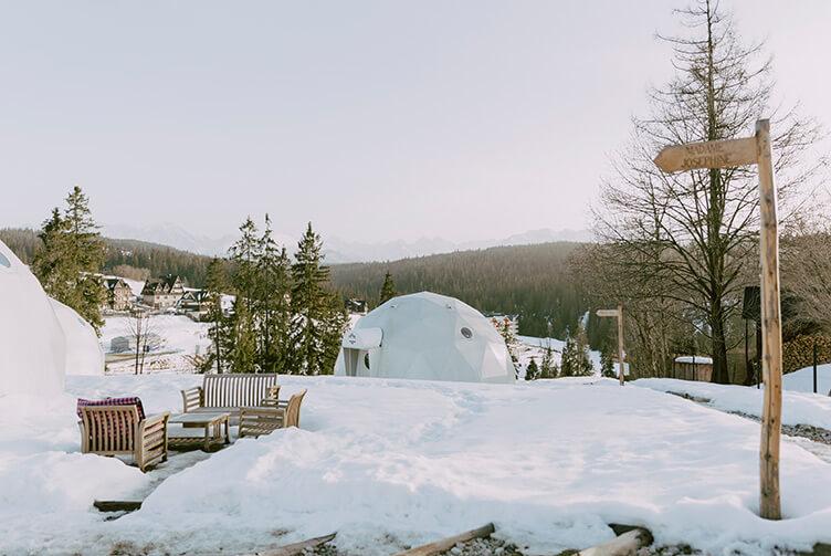 white geodesic domes in snow