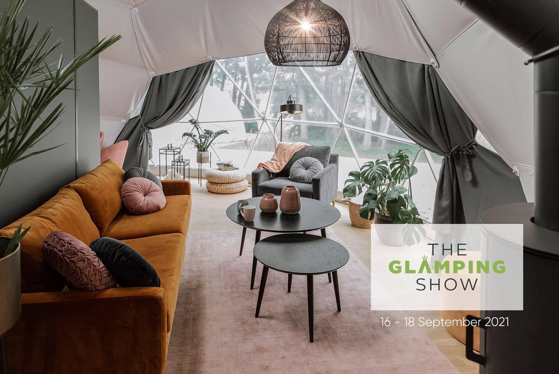 inside at geodesic dome with view on living room with text "the Glamping show 16 - 18 September 2021"