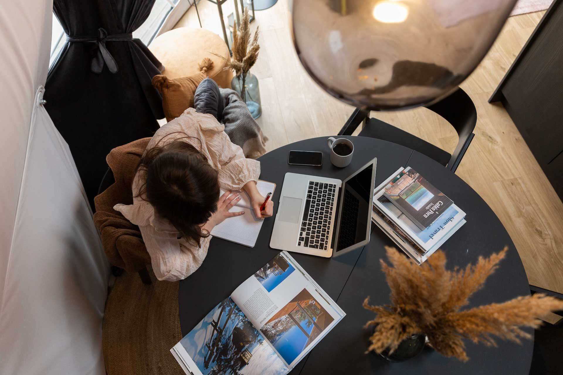 woman at a table inside a geodesic dome