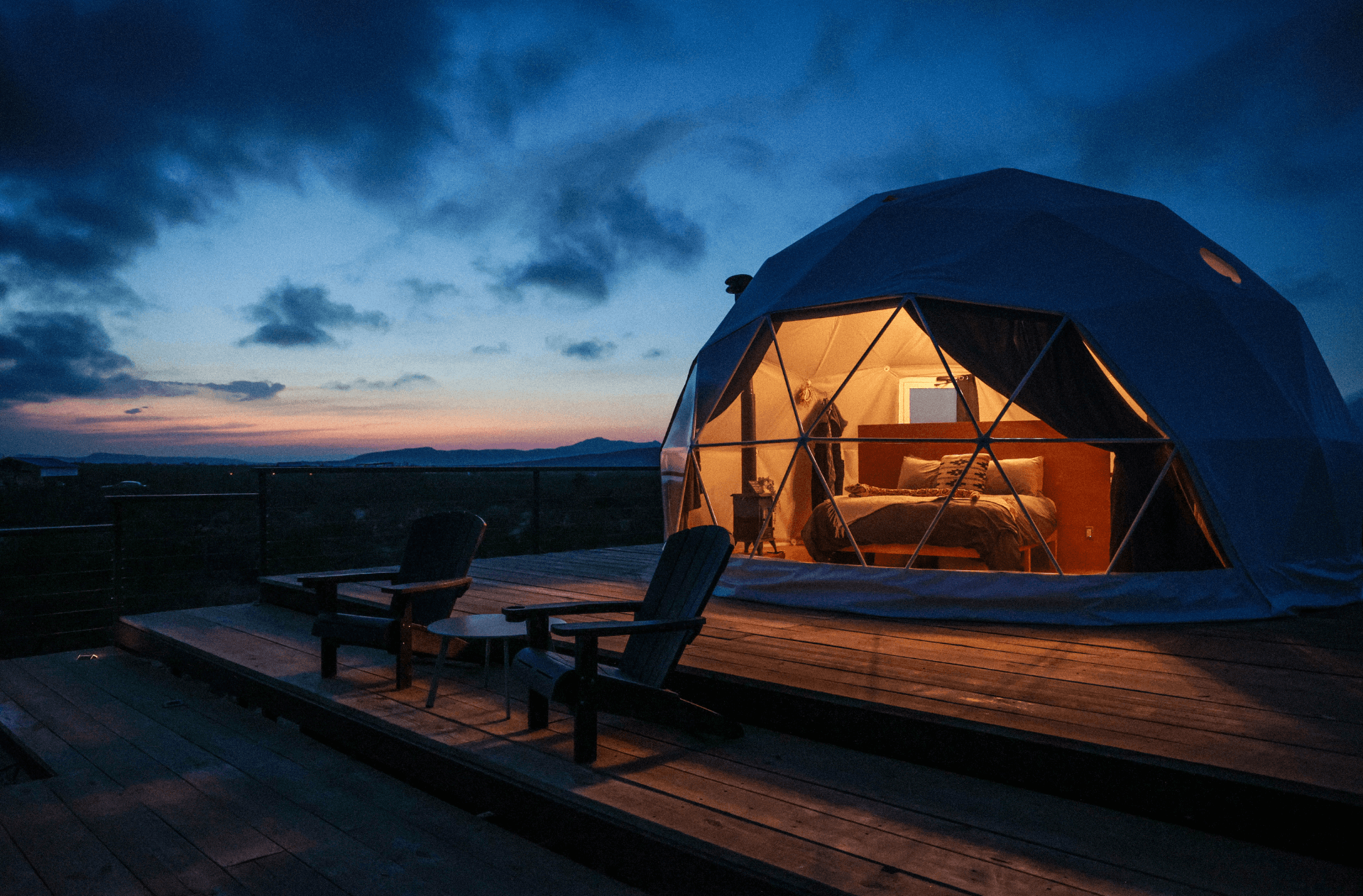 geodesic dome on wooden deck at night