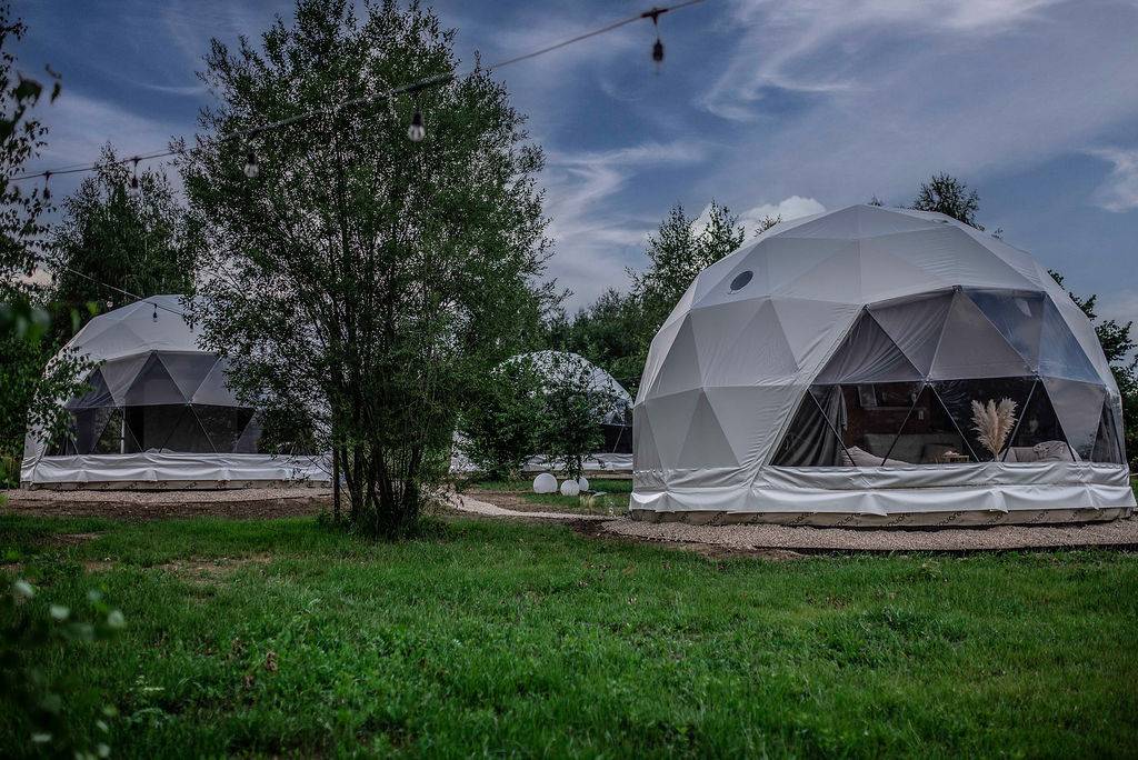 white geodesic domes on the campsite