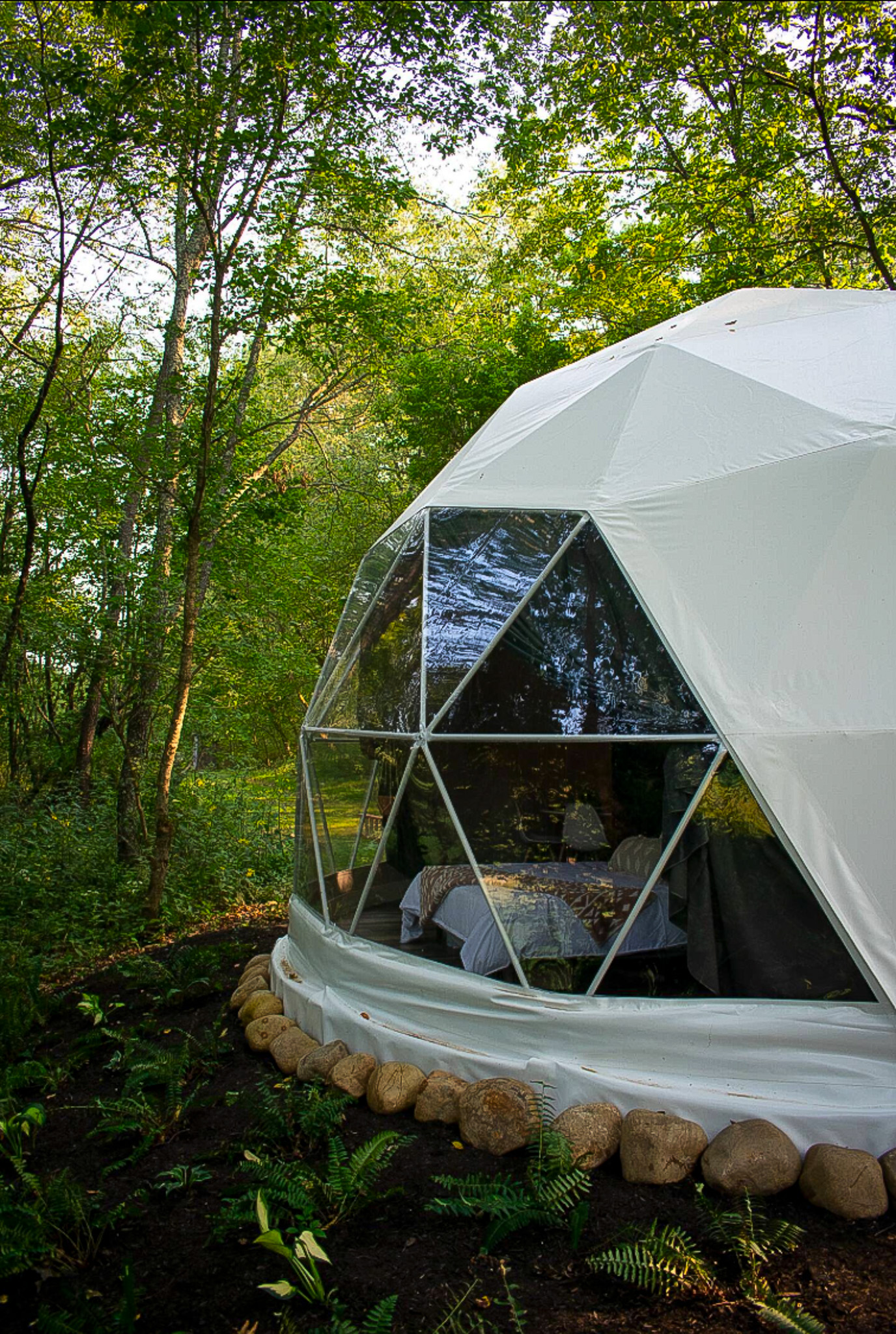 white geodesic dome in the forest