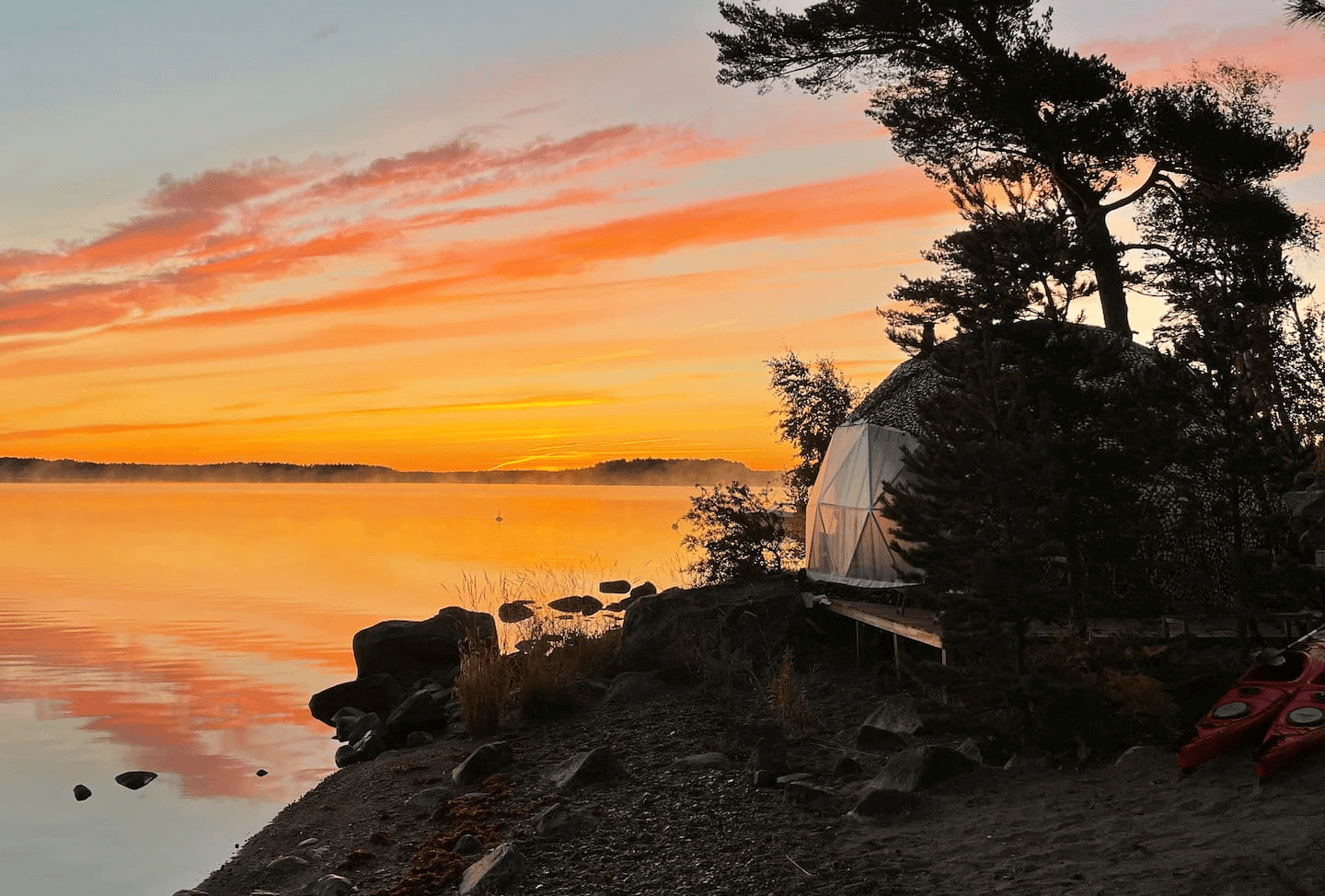 sunset view and geodesic dome on the coast of lake