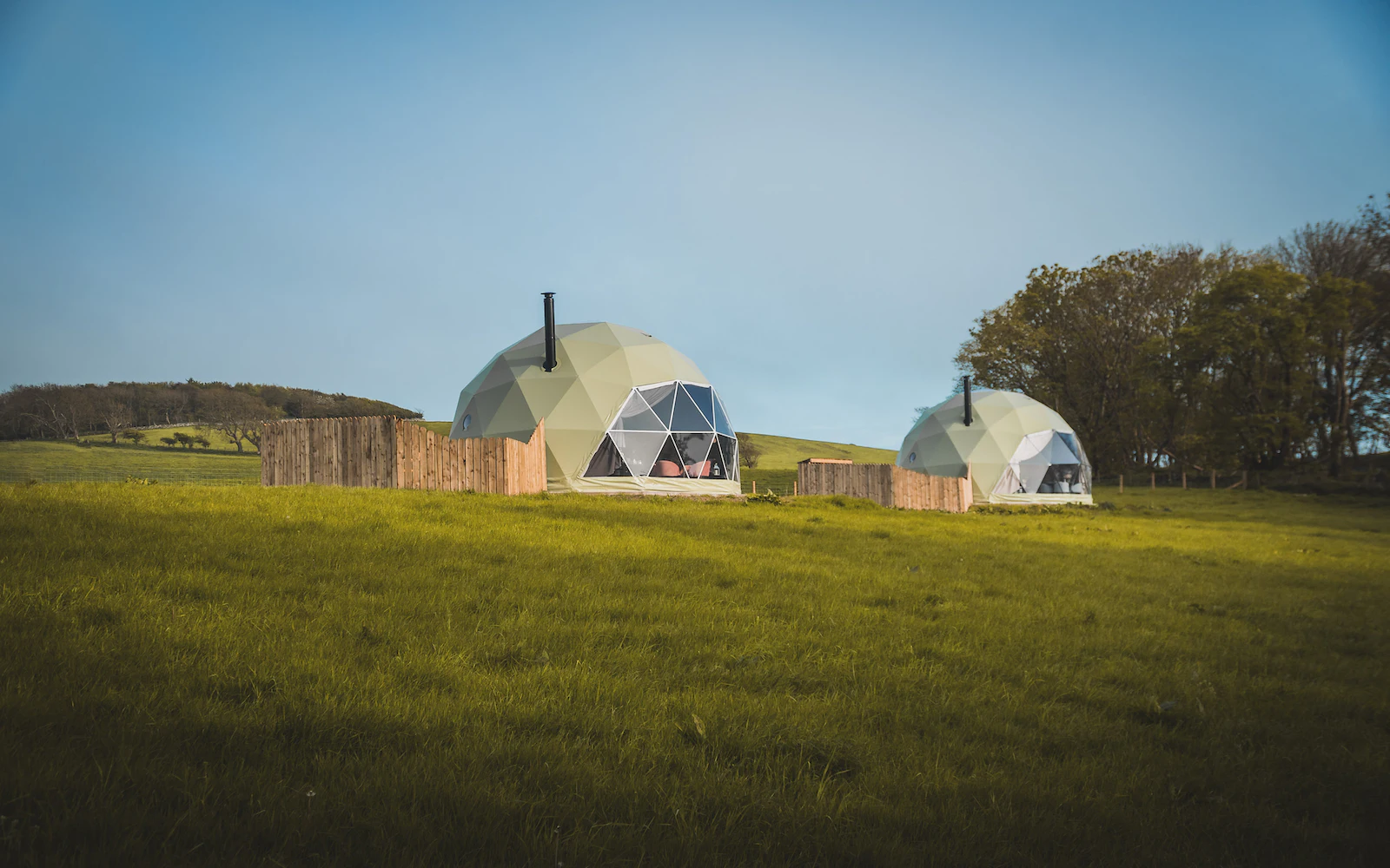 two geodesic domes on the field