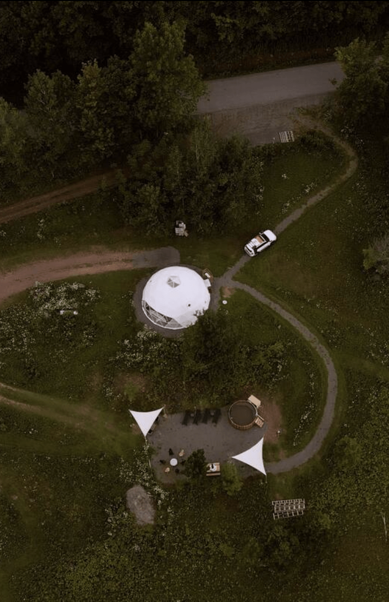 white geodesic dome from a drone view