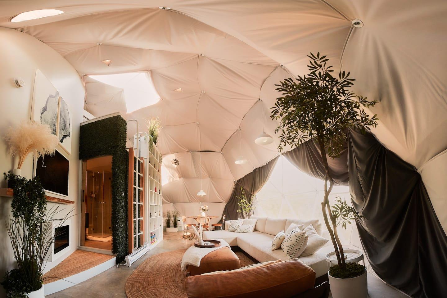 interior of geodesic dome with view of sofa, module and insulation