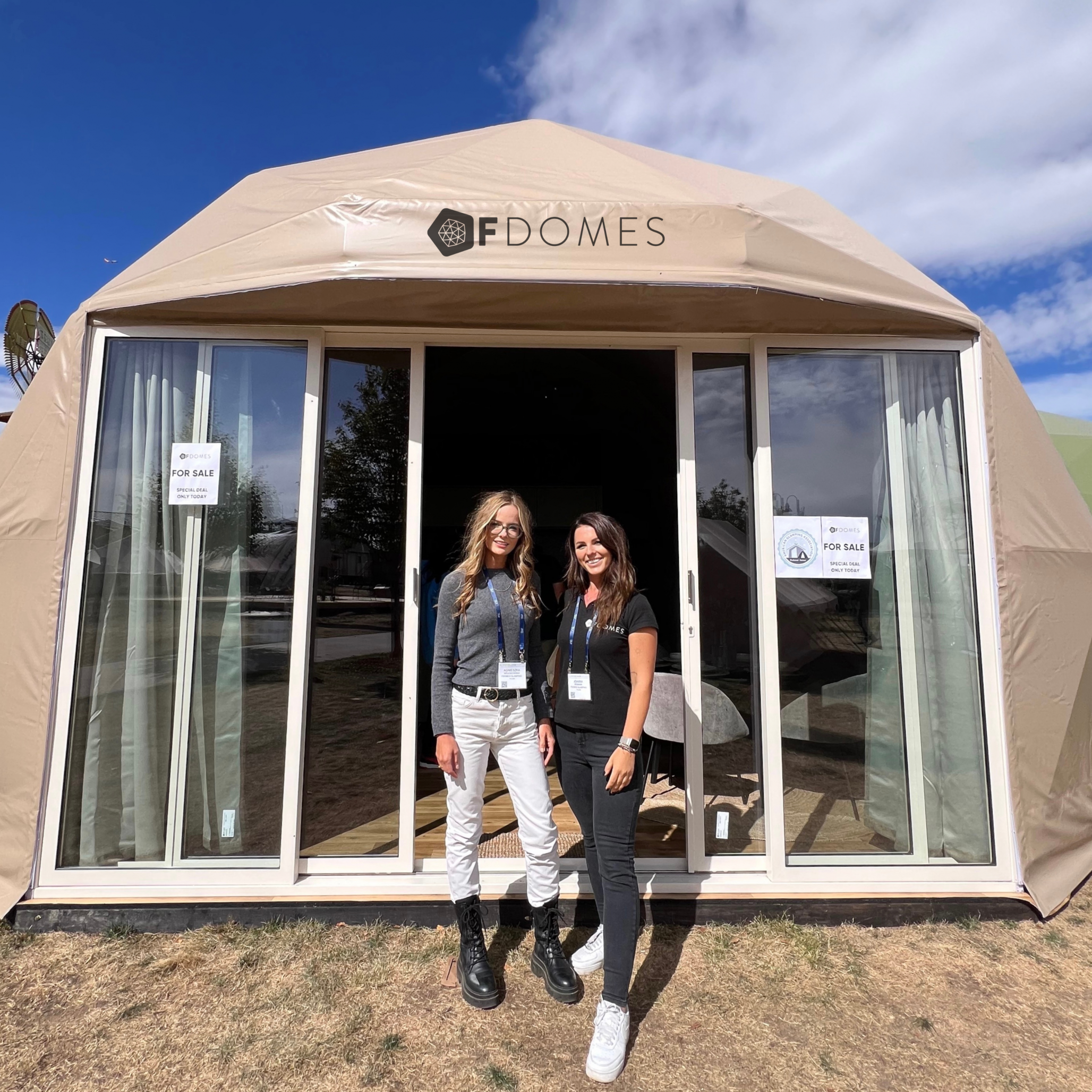 two women in front of geodesic glamping dome at Glamping Show Americas 2023, Colorado, USA