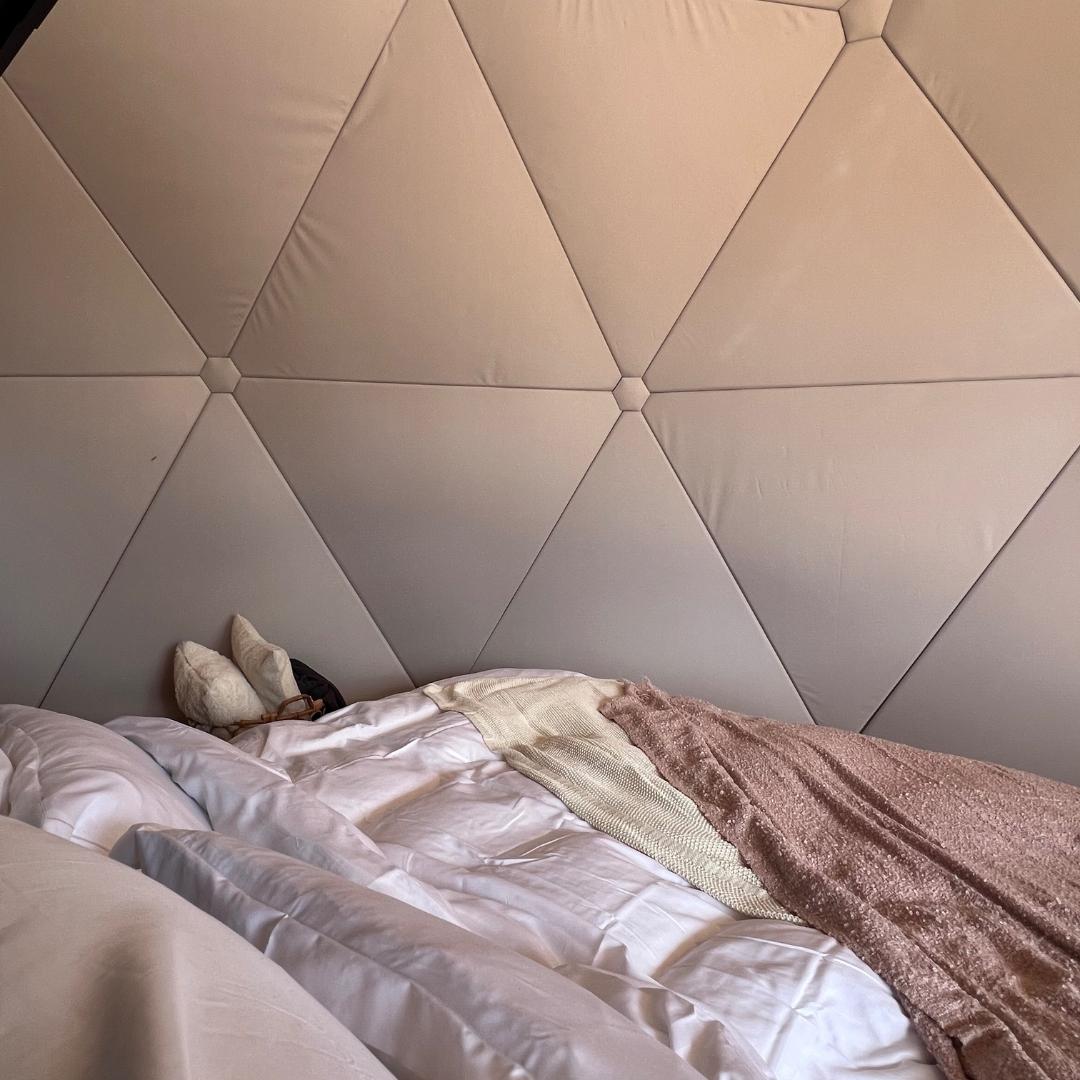 a bed at geodesic glamping dome at Glamping Show Americas 2023, Colorado, USA